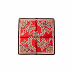 Deep red silk scarf with flowing paisley patterns in white, gold, and brown, dark trim